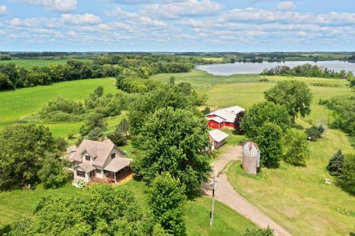 44 Acres includes home, commercial shop building, lakefront, farmland (10 tillable acres) and several outbuildings.