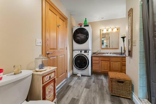 Primary suite bathroom, main floor laundry