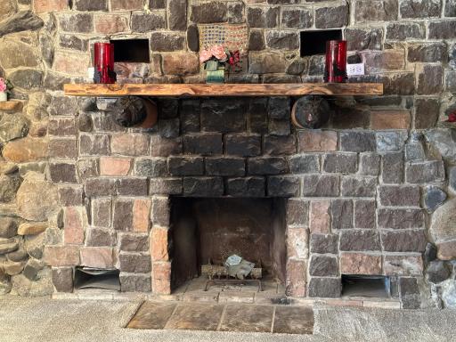 A closer look at the fireplace. Currently fireplace does not work - needs chimney and owners have not used.