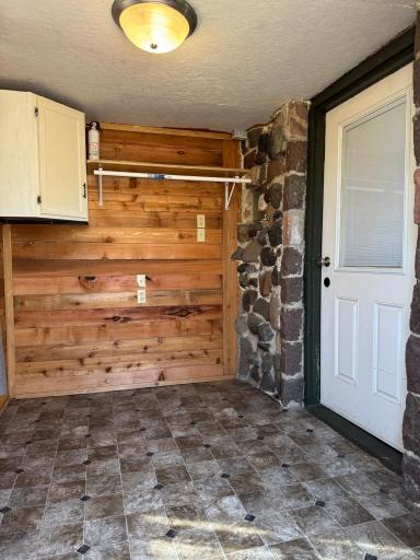 A peek inside the entryway porch. The door on the right leads into the living room.
