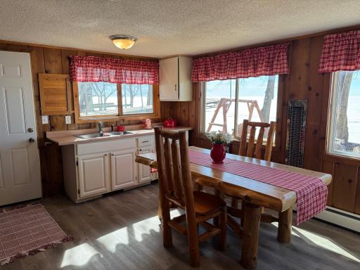 A shot of the adorable kitchen and eat-in dining area.