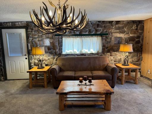 One more shot of the living room showing the exit door to the entryway porch on the left.