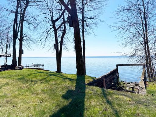 Looking out over the sparkling waters of MilleLacs from the lakeside yard near the boat house structure foundation, which was left in place if you want to entertain boathouse "rehab" plans...