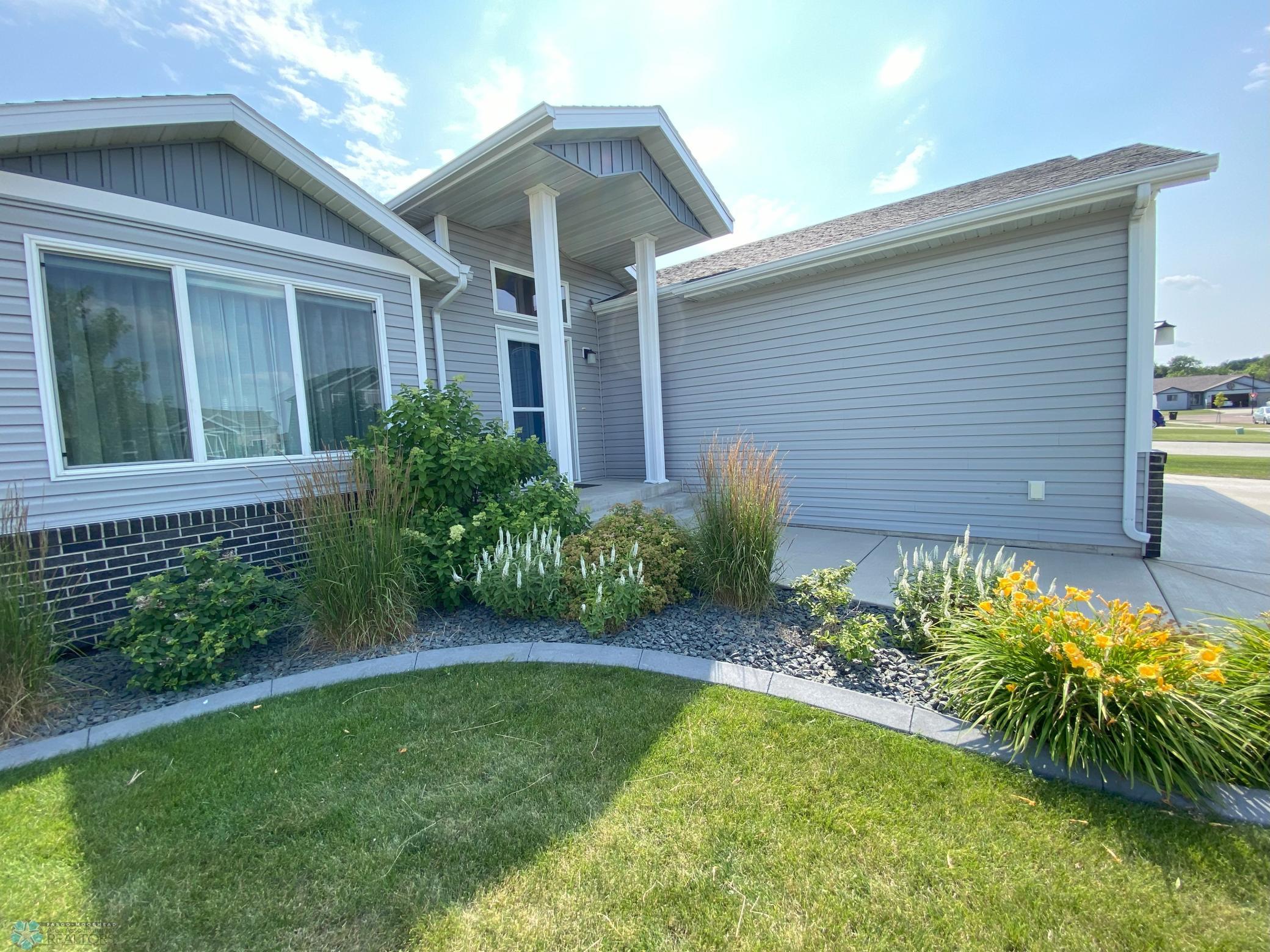 Outside front with summer flowers.jpeg