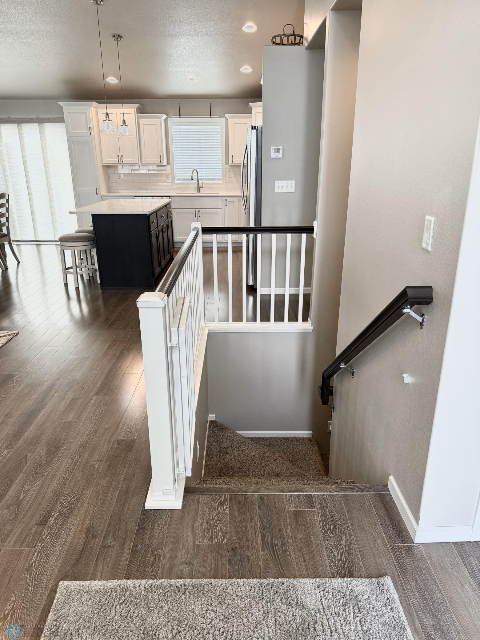 stairs to basement from foyer.jpeg