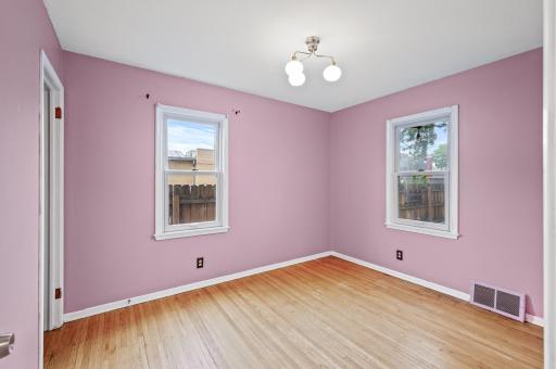 Primary bedroom, main level, hardwood oak flooring