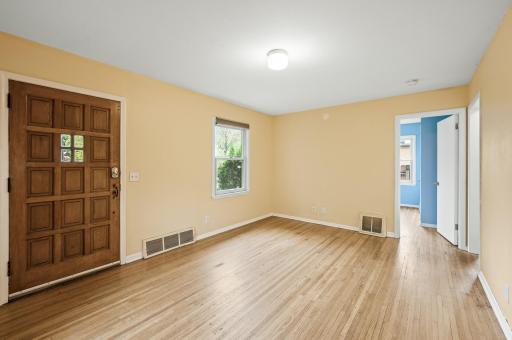 Living room, oak hard wood floors, vinyl window overlooking the front yard