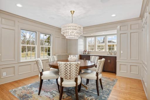 Pretty paneled dining room, with built-in bar