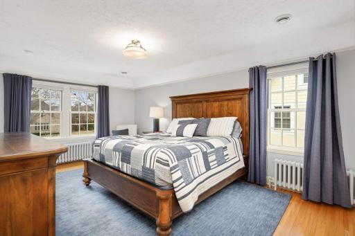 Large second bedroom with ample closets, former primary