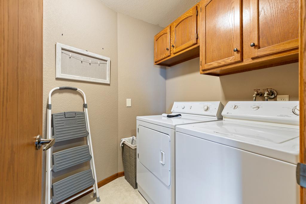 Convenient main floor laundry just steps away from the full bathroom and primary bedroom