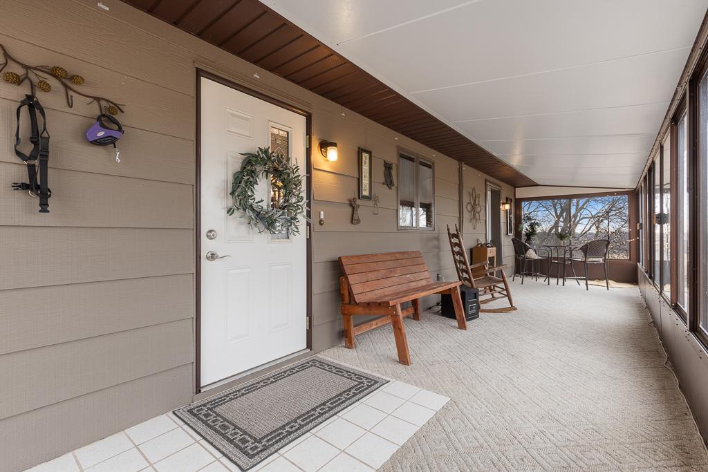 The porch entry brings you right in to the kitchen, making this porch the perfect spot to enjoy a casual meal basking in the natural views
