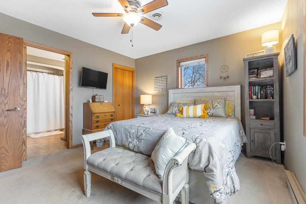 A charming bedroom with access to the main floor full bathroom and some stunning views!