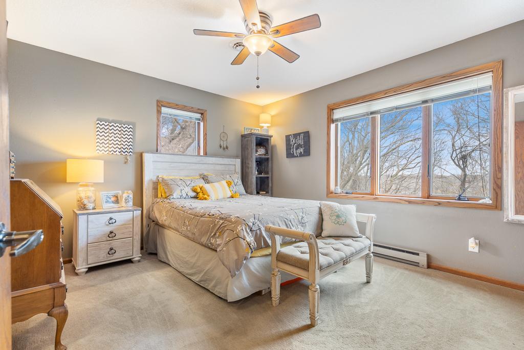Primary bedroom is on the main level and overlooks the golf course.