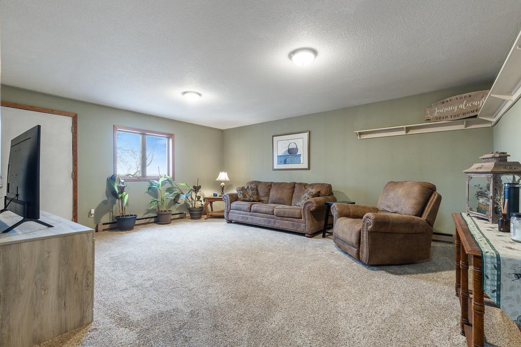 The spacious family room is perfectly situated with walkout access to the patio! GREAT for entertaining or for your relaxing summer evenings!