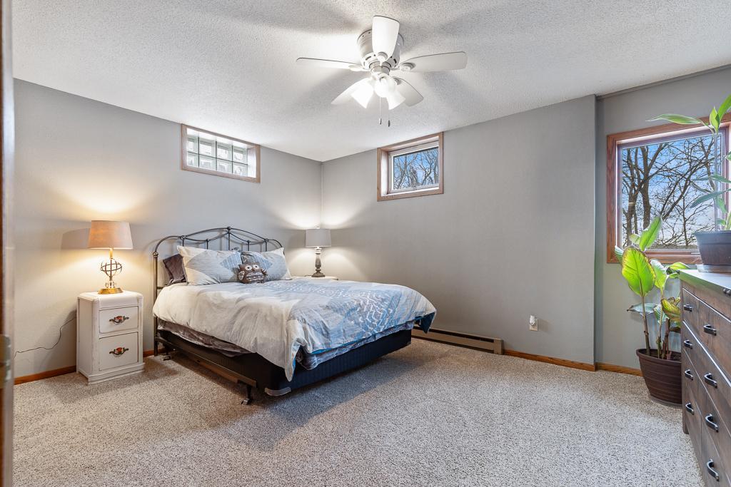 A great sized lower level bedroom offers a private retreat for your guests