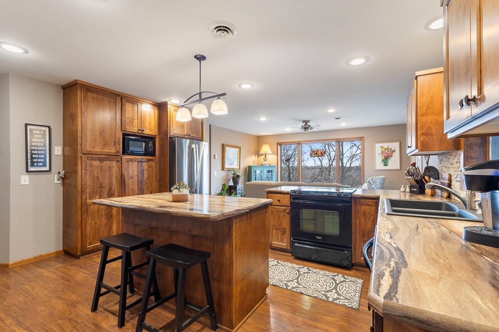 CUSTOM kitchen. Stunning cabinetry, colors schemes, view, island space, NEW appliances, etc.