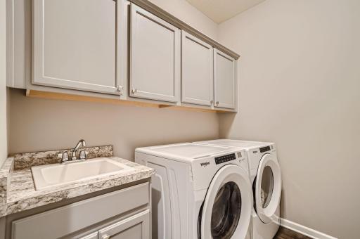 Main level laundry room is conveniently located