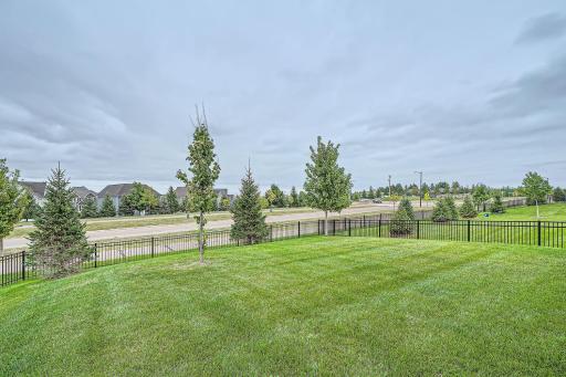 Fenced yard with no neighbor directly behind