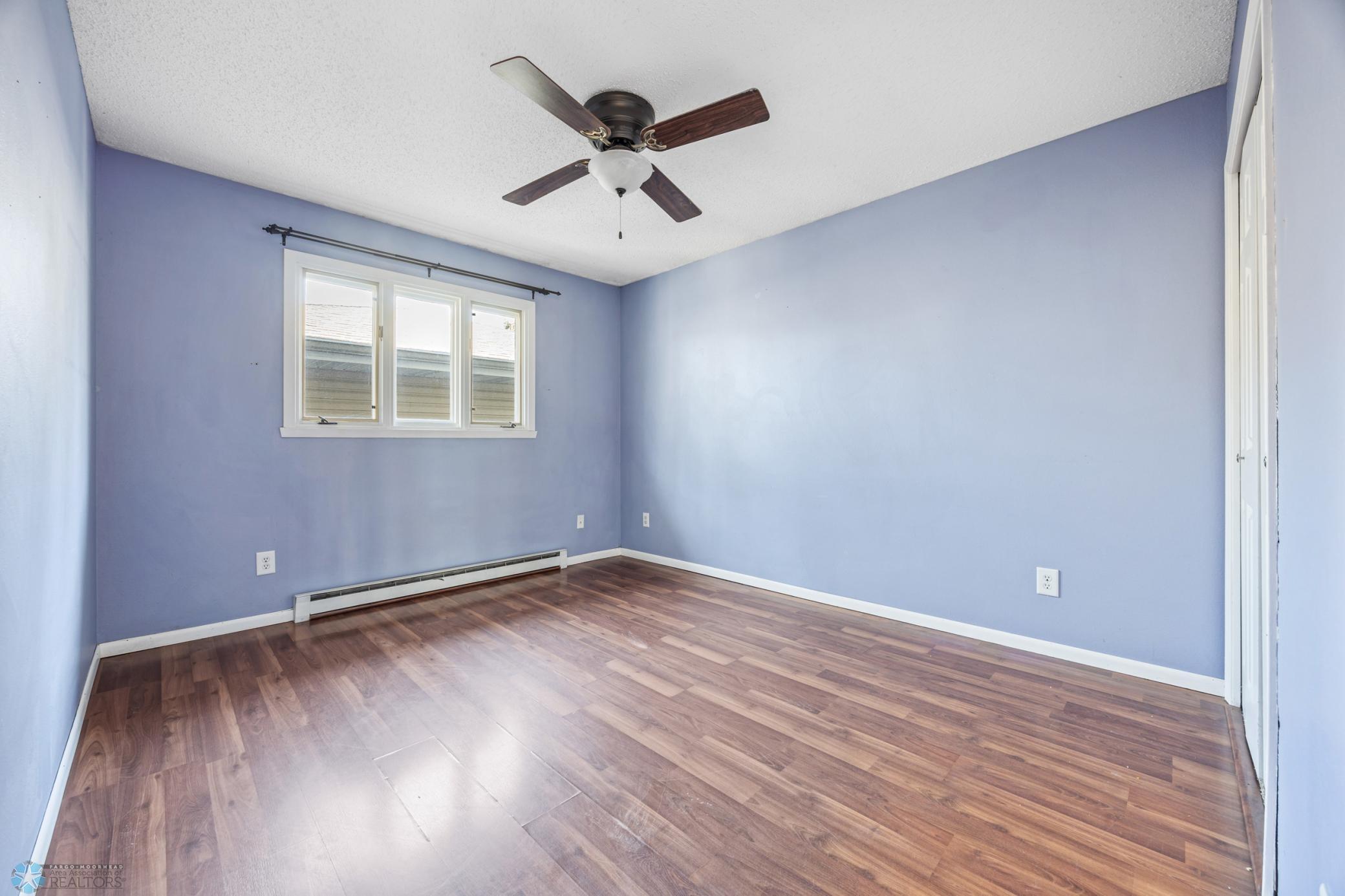 Primary Bedroom w/ door to Bath