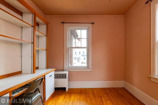 Main level bedroom has built-in desk/bookcase.
