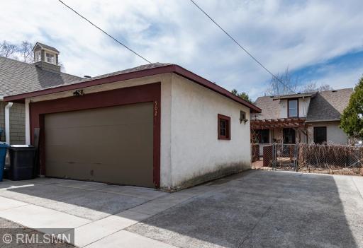 Two car garage plus parking pad for additional vehicle.