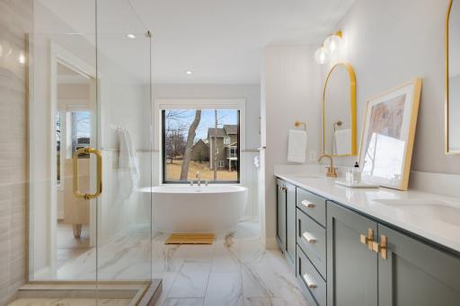 DREAM Bathroom! Great soaking tub, dual vanity with plentiful storage, tiled shower with custom glass paneling/door, automated window coveirng.