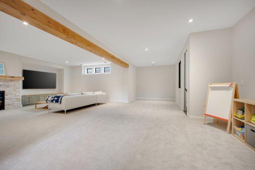 Three in one area that could boast a game area at the rear and possible future bar to the right. Great area for toys!