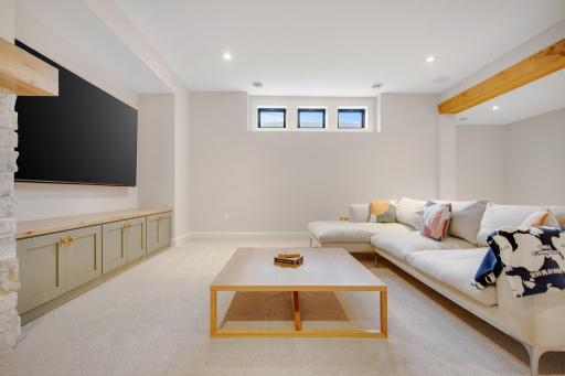 Custom built-ins, gas fireplace ceiling beam, space for the 85 inch TV. This will be your oasis for years to come as it is inviting and a multifunctional area.