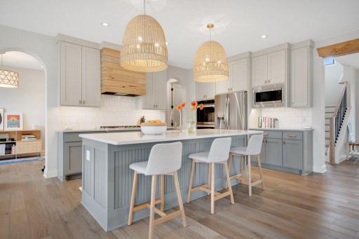 Not a detail has been overlooked with curved archways, black trimmed windows, plentiful and updated can lighting, automated window coverings, ceiling beams. Move right-in better THAN new!