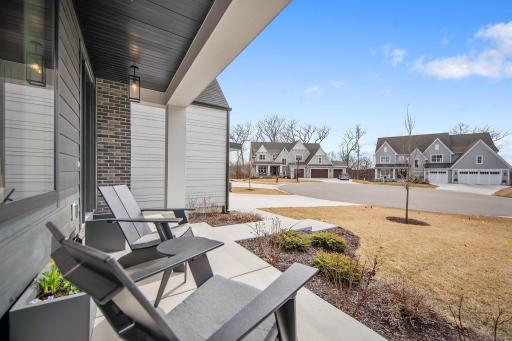 Sips of coffee from your front porch overlooking the cul-de-sac that adjoins the neighborhood sidewalk and mere steps to the trails of Lake Lucy. Step inside...