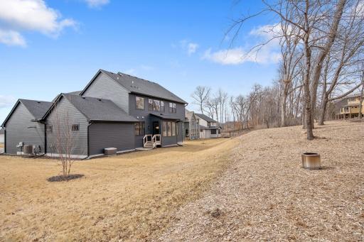 Great yard with a balance of flat area, nature, and possible future design needs/wants. Current homeowner removed extra brush to allow for future patio/pergola/dining/porch area. Gutters have already been installed!