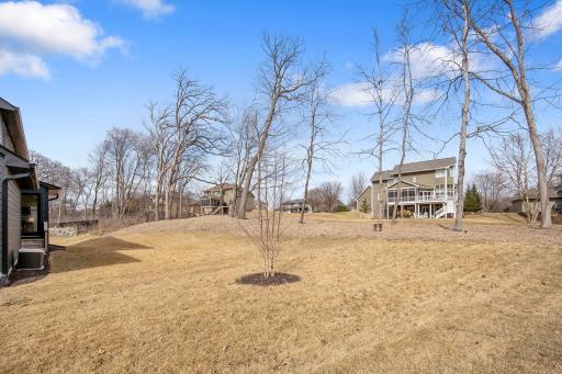 GENEROUS lot! A few weeks away and trees will be leafed out and the lush lawn will host your weekend bonfires.