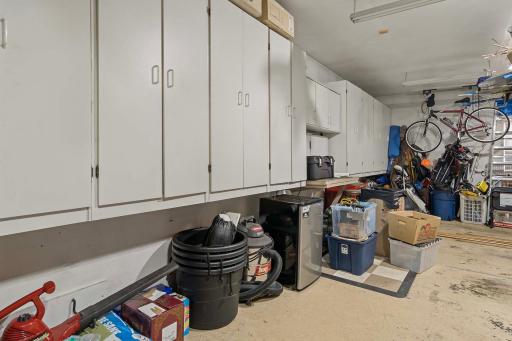 The three-car garage has an incredible amount of cabinetry for storage.