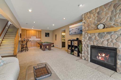 Lower level family room with stone, gas fireplace and wet bar.
