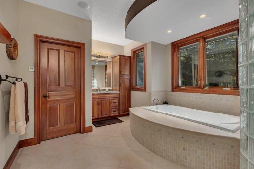 Indulge in the soaking tub, large walk-in shower, and dual vanities for a true retreat experience.