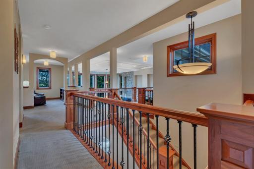 On the upper level, you will discover four generously sized bedrooms plus a huge bonus room that has been transformed into the perfect kids hangout and bunk area, three beautifully appointed bathrooms, and a cozy library nook.
