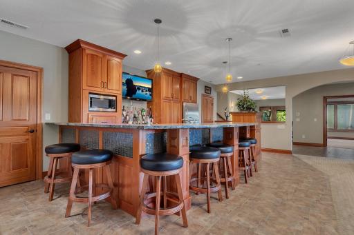 This bar is yet another of the many inviting spaces in the home, perfect for making memories, sharing laughs, and hosting unforgettable get-togethers!