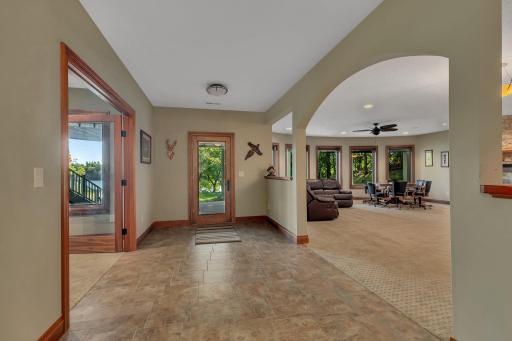 This lower-level walkout is your direct gateway to lakeside living! With easy access to the outdoors, step right from your comfortable indoor space into the natural beauty surrounding the lake.