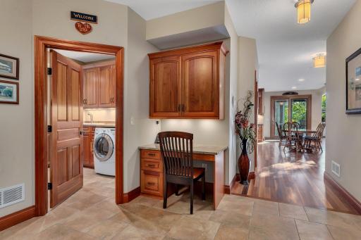 This desk nook is perfectly situated between key areas of the home. Whether used for organizing, meal planning, or catching up on emails, this versatile area is both functional and stylish!