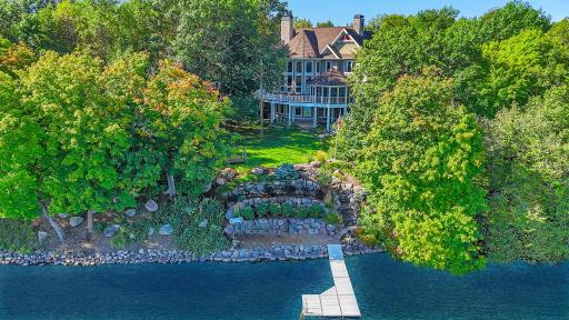 Welcome to this magnificent 6-bedroom, 6-bathroom home, nestled on approximately 2.5 acres with nearly 230 feet of pristine lakeshore, offering over 8,000 square feet of thoughtfully designed living space.