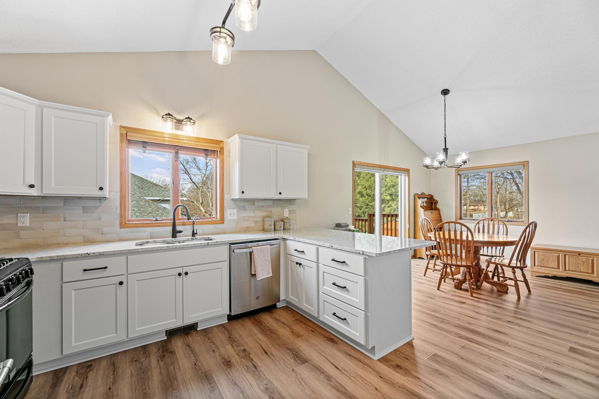 ...featuring white, shaker cabinets and drawers...