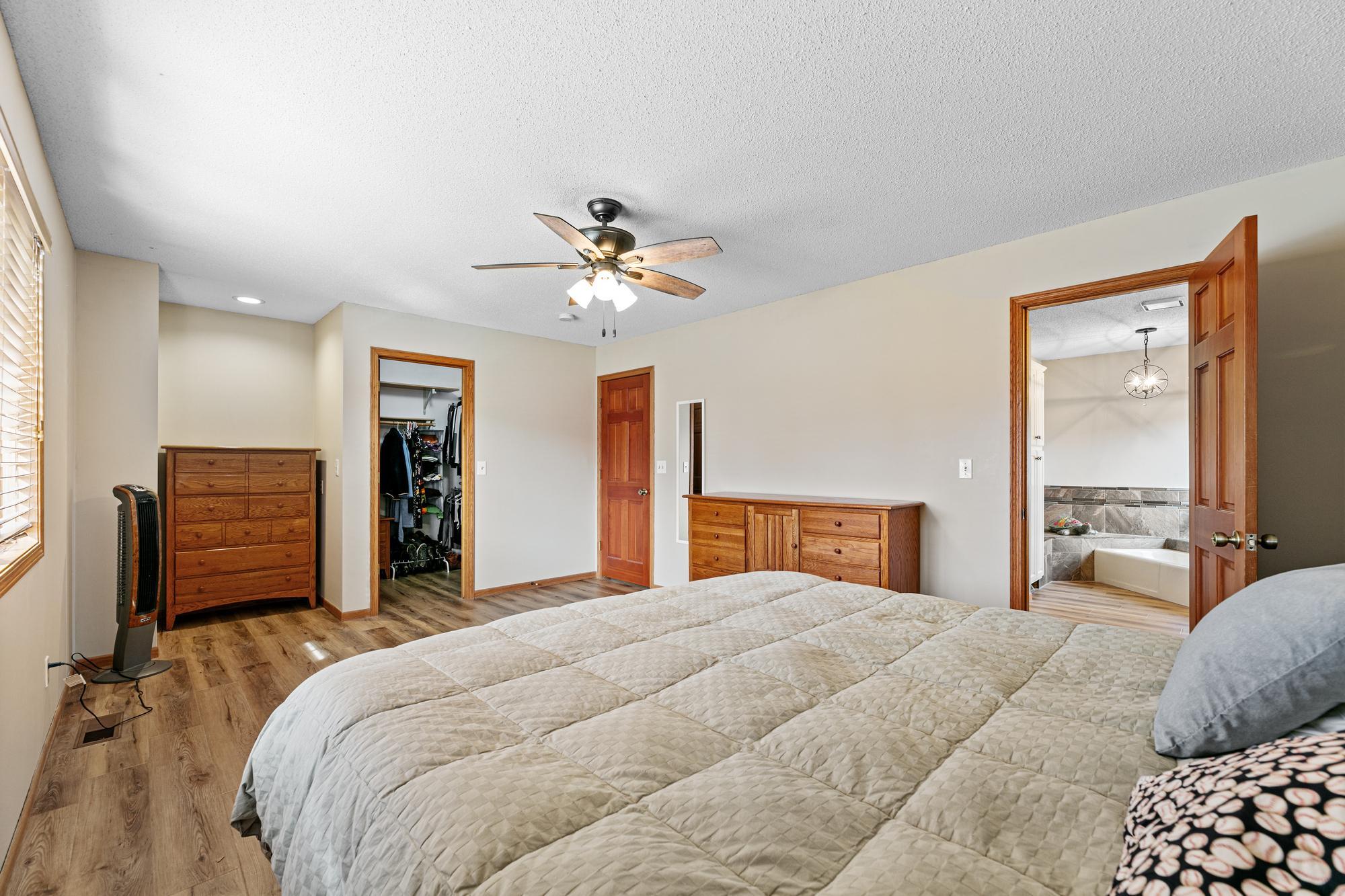 Primary bedroom with walk-in closet
