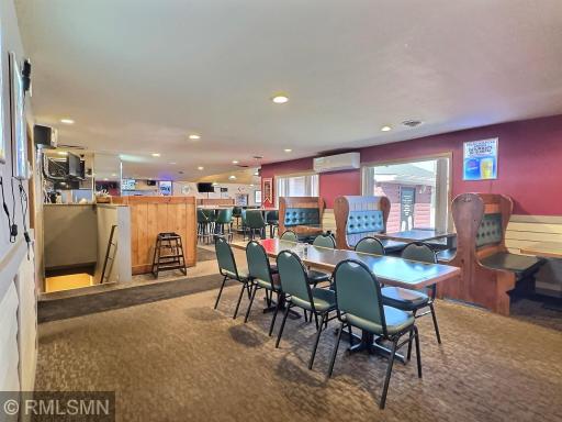 Another dining area with tables and booths. Restrooms are located in this part of the restaurant.
