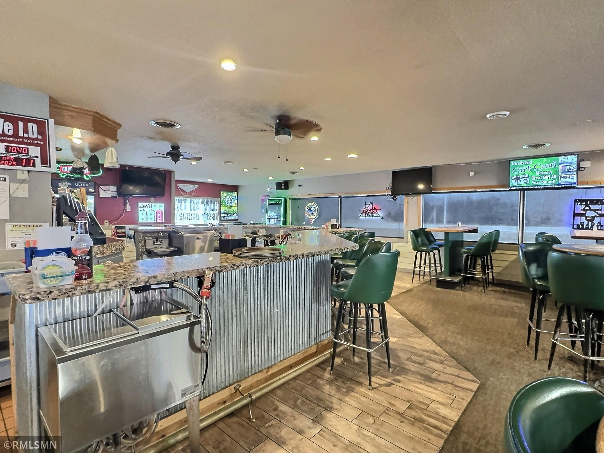 The bar opens to the entire restaurant so bartenders can keep an eye on everything.