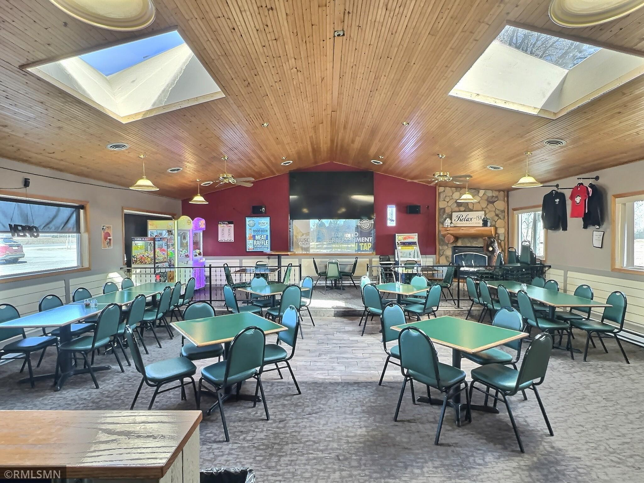 The interior features nine TVs, nine high-top tables, nine booths, and nine large tables, with the bar itself surrounded by 15 barstools—perfect for socializing.