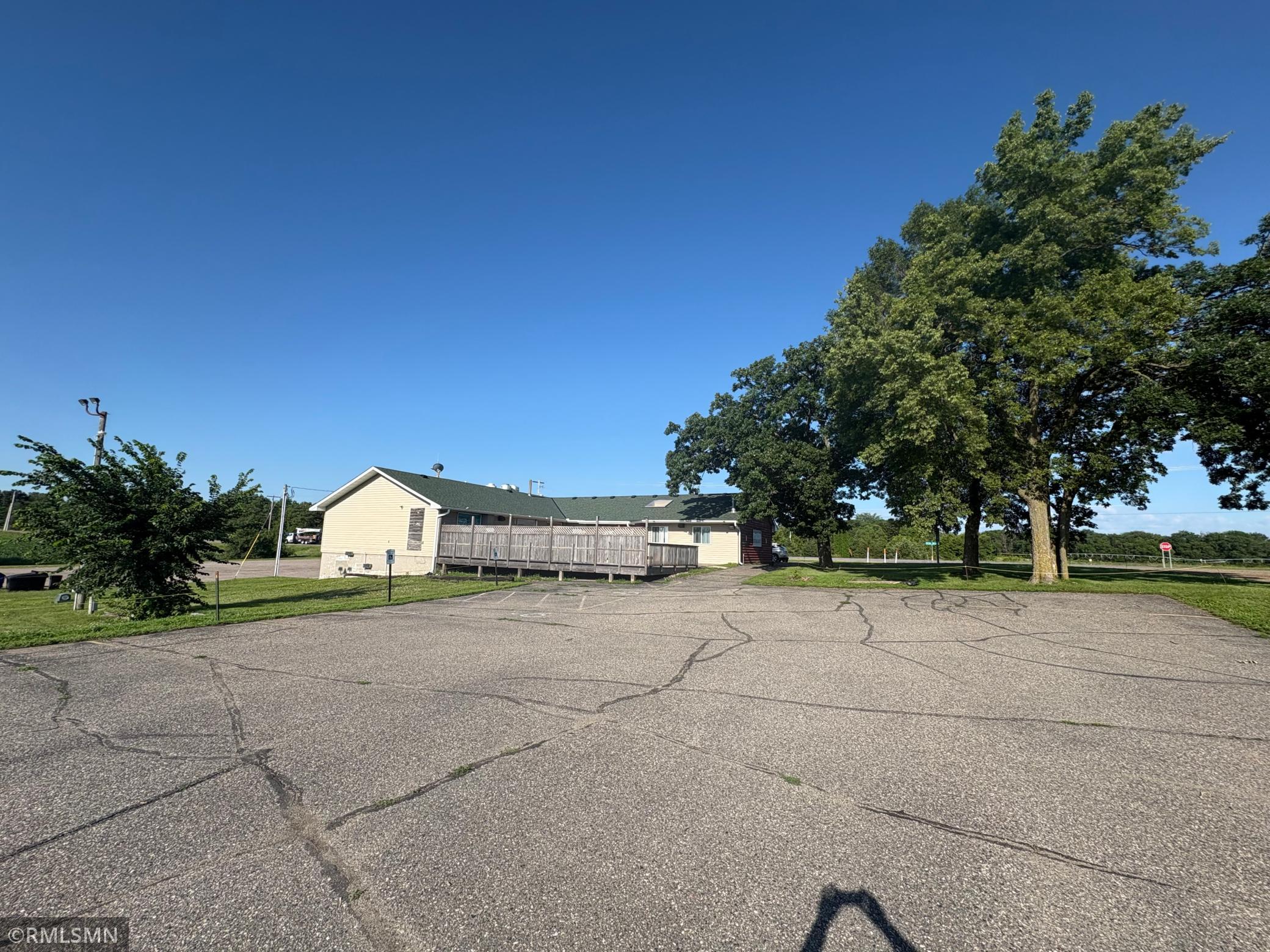 Overview of the back patio and also the green space in the back that has been used for a Bags league. Plenty of room for events and gatherings.