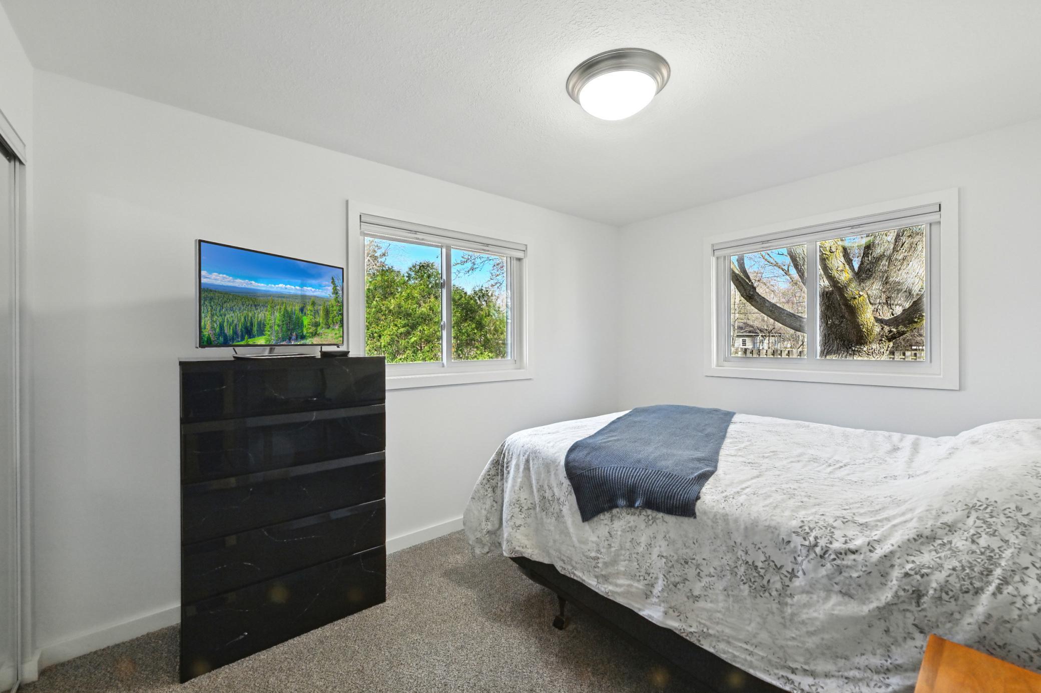 2nd main level bedroom with a large closet and new plush carpet