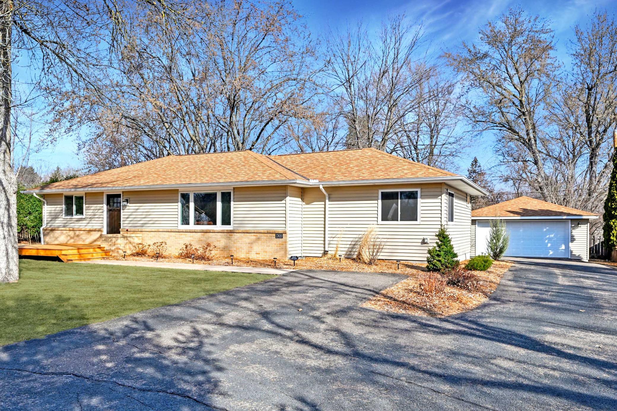 Expansive driveway and detached garage perfect for hosting friends and family