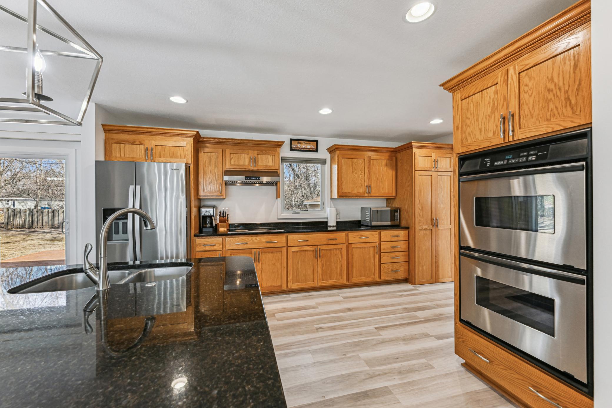 Main level kitchen with walk out access to the backyard