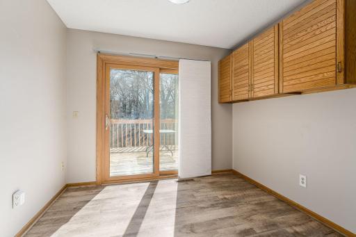 Sunny bonus space off the living room, ideal as a reading nook, home office, or plant haven—walk out to the private deck.
